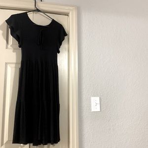 Plain black dress; size medium; round neck with a little tie